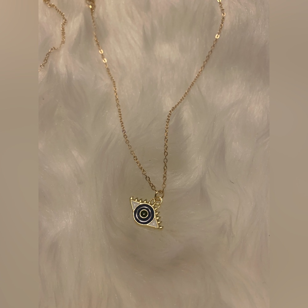 GOLD NECKLACE WITH UNIQUE CHARM